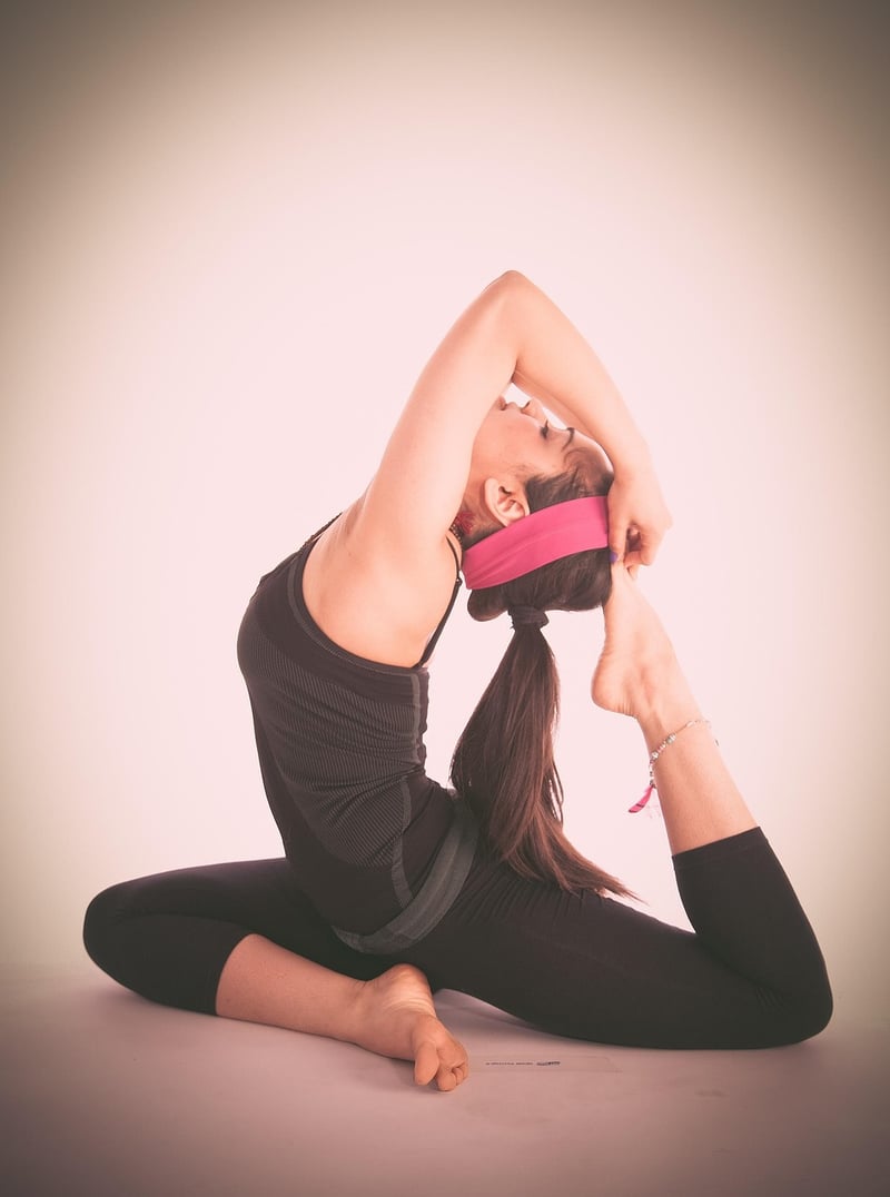 Woman practicing Vinyasa yoga